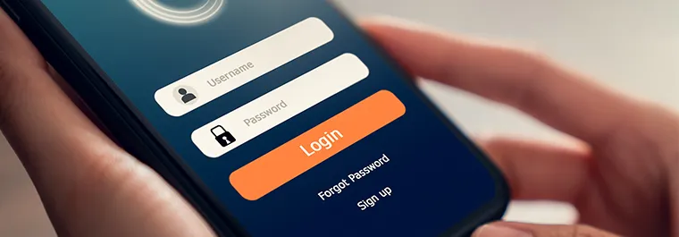 hands holding a smartphone with login screen on